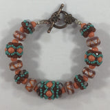 Handmade Beaded Bracelet strung with Swarovski Pearls, Coral Lampwork Beads, and Turquoise Glass Seed Beads. Size 5