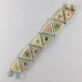 Bracelet, Triangle Weave, Glass Seed Beads done in Pastels. Button closure.