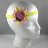 Stitched Headband for a child of 12-18 mos.  Pretty Yellow and Pink Bow is on a hair-clip so it can be worn without the yellow headband.