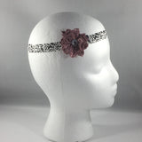Headband, Size Newborn.  Hand Crocheted Mauve Flower on a black pattern stretch headband.