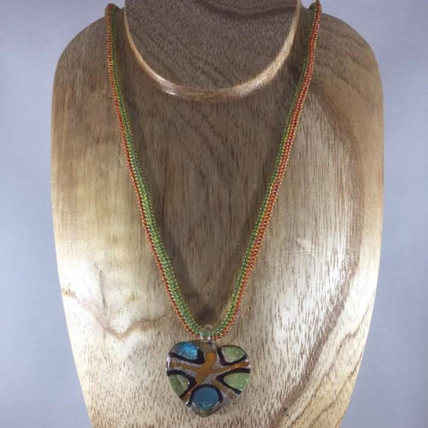 Green and Orange Rope Necklace with Glass Seed Beads and a Lampwork Heart Pendant.  Sterling clasp.  Necklace 18"