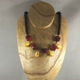 Red and Gold chunky bead necklace.  Necklace measures 18" around.  Sterling magnetic clasp and sterling ear wires.  Earrings included.