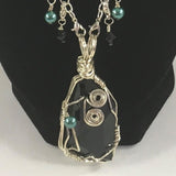 Necklace, Black Swarovski Cosmic Pendant on silver chain with Swarovski embellishments.