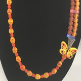 Necklace, Orange round beads, yellow stripped beads, and Butterfly embellishment