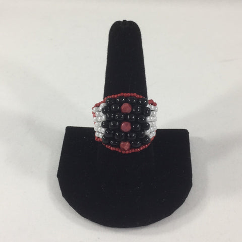 Red, Black and White Glass Seed Bead Weave.  Size 9.  Although this ring was strung with Fireline, constant exposure to water is not recommended.