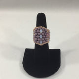 Beaded Ring, Pink and Lavender Glass Seed Bead Band with White Bead Accents.  Size 7 1/2.  Although this ring was strung with Fireline, constant exposure to water is not recommended.