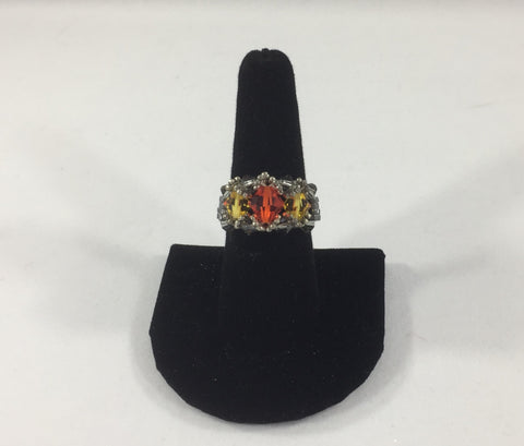 Beaded Ring with Orange Swarovski Bicone and 2 Yellow Swarovski Bicones. Silver Gray Glass Seed Bead Band.  Size 8 1/2.  Although this ring is strung with Fireline, constant exposure to water is not recommended.