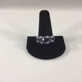 Beaded Ring with Swarovski Amethyst Bicones and Lavender Bicone accents.  Shimmer purple band made with Glass Seed Beads.  Size 12.  Although this ring is strung with Fireline, constant exposure to water is not recommended.