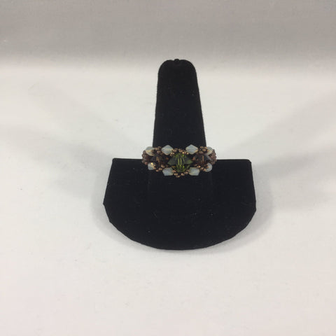 Beaded Ring, Green and Amethyst Swarovski Bicones with Opal Swarovski Accents.  Size 11.  Although this ring is strung with Fireline, constant exposure to water is not recommended.