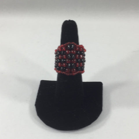 Beaded Ring, with Red and Black Glass Seed Beads in alternating rows.  Size 7.  Although this ring was strung with Fireline, constant exposure to water is not recommended.