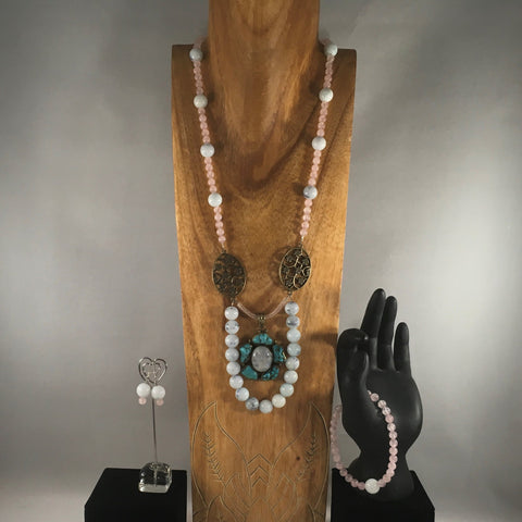 Light pink and Marbled Light Blue Beads with Metal embellishment and a turquoise pendant.  Necklace measures 30".  Bracelet 7 1/2".  Bracelet and Sterling earrings included.