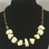 Necklace, Chunky white bead necklace with faceted gold tone beads.