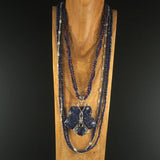 Sterling necklace with four strands: two of Blue Lapis gems, one of Sterling Link Chain, one of Red Glass Seed Beads with a Blue Soladite and Sterling Butterfly Pendant.  Necklace 34".