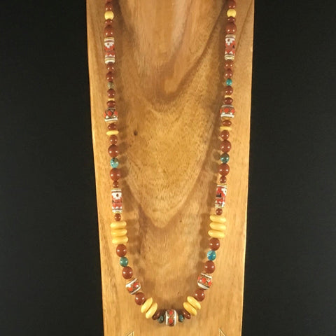27-1/2" Necklace and tube earrings by Cocopah. This Necklace is a tribute to the Puebla Dwellers of Chaco Canyon. Red Jasper, bone, clay and Kingsman mine turquoise. Sterling.  Earrings included.
