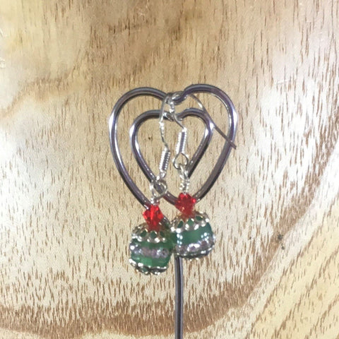 Pierced Earrings on ear wires.  Green Sparkles Ball with Red Swarovski bicones, and silver bead caps. Sterling