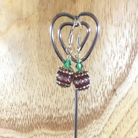 Pierced Earrings on Sterling Ear wires.  Red Sparkle Round Bead with Green Swarovski Bicones and silver bead caps, Sterling
