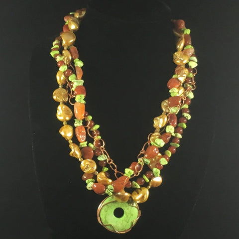 Copper Path. 4 Strand Necklace with green turquoise stabilized chips, carnelian, gold fresh water gold pearls and copper. Necklace 24".  Earrings included.  On sale. 