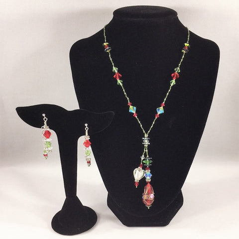 Red and Green Christmas colors Swarovski's Necklace with a Tassel and Lampwork Beads.  Sterling.  Necklace 17 1/2" with a 2 1/2" drop.  Sterling post earrings included.