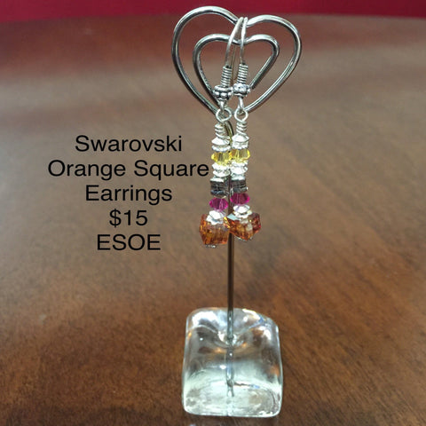Pierced Sterling Silver Earrings with various Swarovski Crystals (Orange cube,  Fuchsia Round, Gray Cube and Yellow Bicone).  Sterling findings and Sterling ear wires.