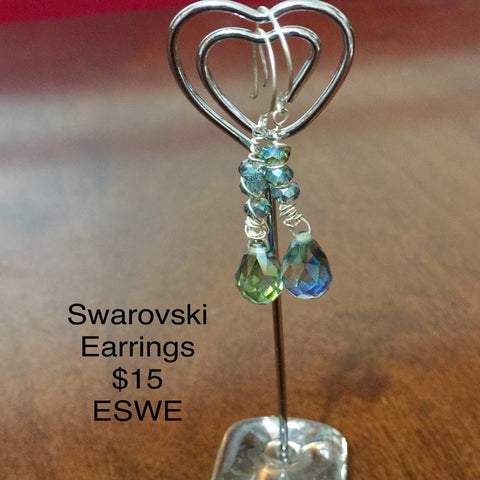Swarovski blue beads with a wire swirl earrings. Sterling