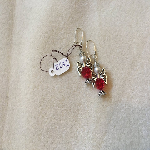 Pierced Earrings with Sterling Ear Wires.  The Christmas Angle is made with a Red Swarovski Round Bead, silver wings, and a White Swarovski Pearl.  Sterling.