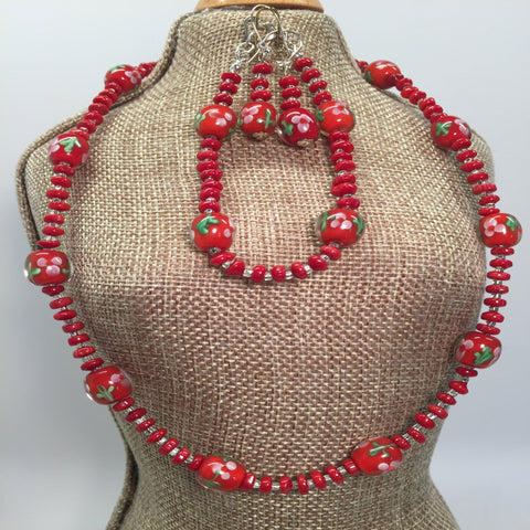 Chinese Lampwork red flower bead necklace set.  Necklace 17", bracelet 6 3/4".  Earrings included.  Sterling silver findings.