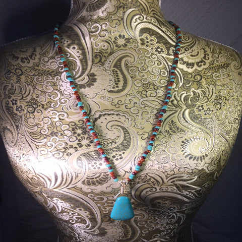 Stabilized Turquoise Pendant Necklace strung with Glass Seed Beads in Turquoise and Jasper.  Sterling clasp.  Length 20"