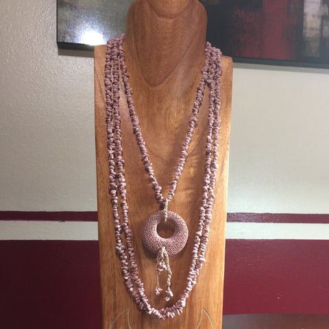 3 Strands of Indian Pale Pink with a Donut Pendant.