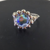 Ring, Sterling Wire Wrap with Sterling beds surrounding a Blue Glass Center Bead.  Size 6 3/4