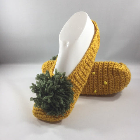Crochet Slippers with Squash Color Acrylic Yarn and a Green Yarn Pom Pom.  Size 7.