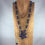 Lapis blue disk beads, Czech faceted green glass beads.  Handmade flower Pendant. Sterling. Earrings included.  Necklace 25" with 3" flower