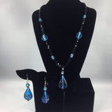 Midnight Music. Blue and Black Lampwork beads and Pendant, Czech faceted fire polished Black beads. Sterling. Necklace is 20". Includes earrings. Cocopah Collection.