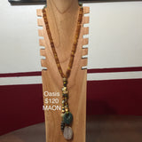 Midnight at the Oasis Necklace. Amber shade beads with multi media drop.  A Cocopah collection.