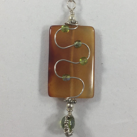 "Pathway". Wire Wrapped Amber Pendant with a Sterling Chain.  Earrings included.  18"
