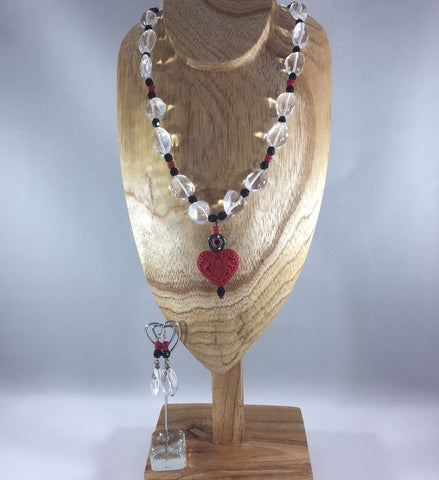 Necklace Red Cinnabar, Sterling.  Was $36.00.  Now $18.00.  There are natural flaws in some of the stones.  This doesn't take away from the simple beauty of this necklace.  Earrings included.  Necklace 20" with a 2" drop.