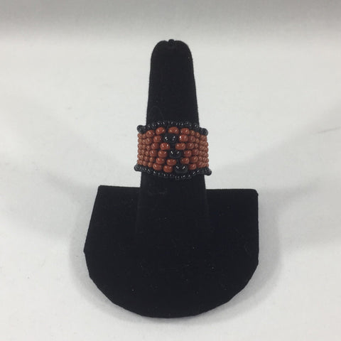 Ring, Beaded Weave, Tan and Black Glass Seed Beads.  Size 7 1/2.  Although this ring is strung with Fireline, constant exposure to water is not recommended.